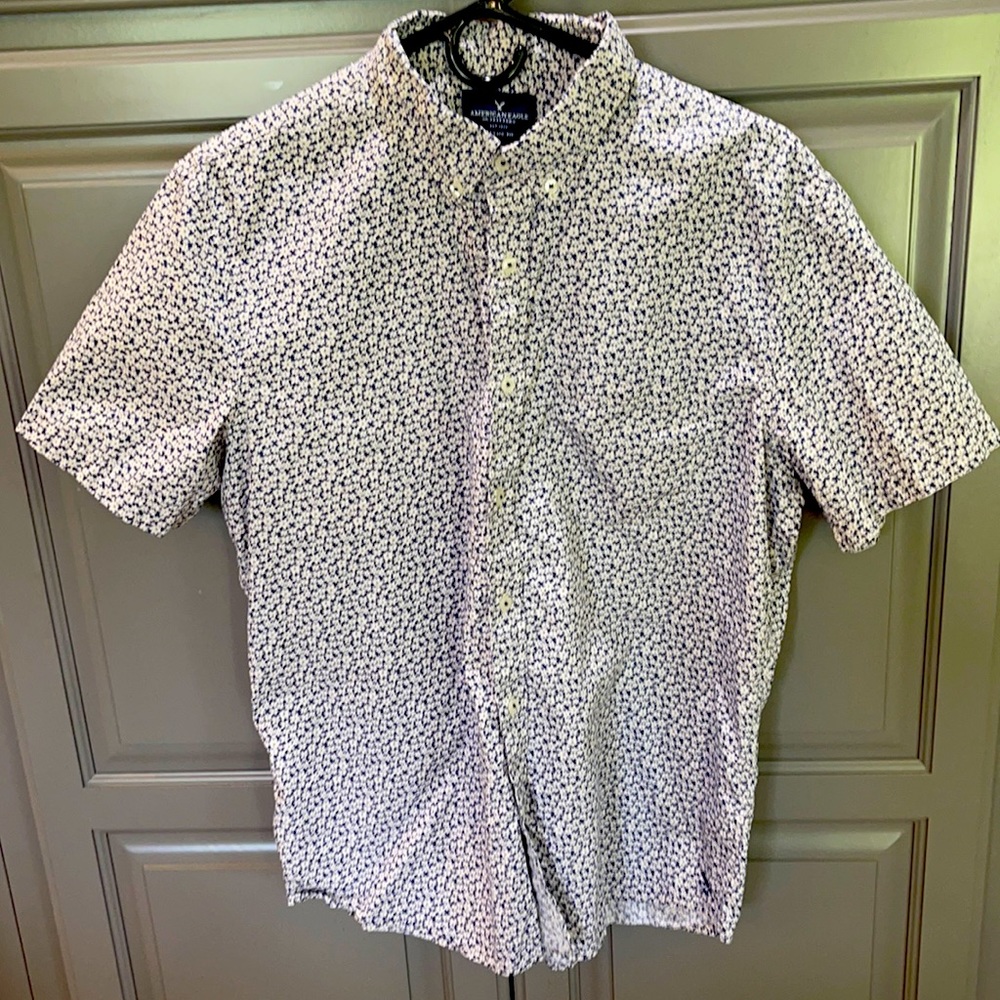 Men’s navy blue, short sleeve button up shirt.